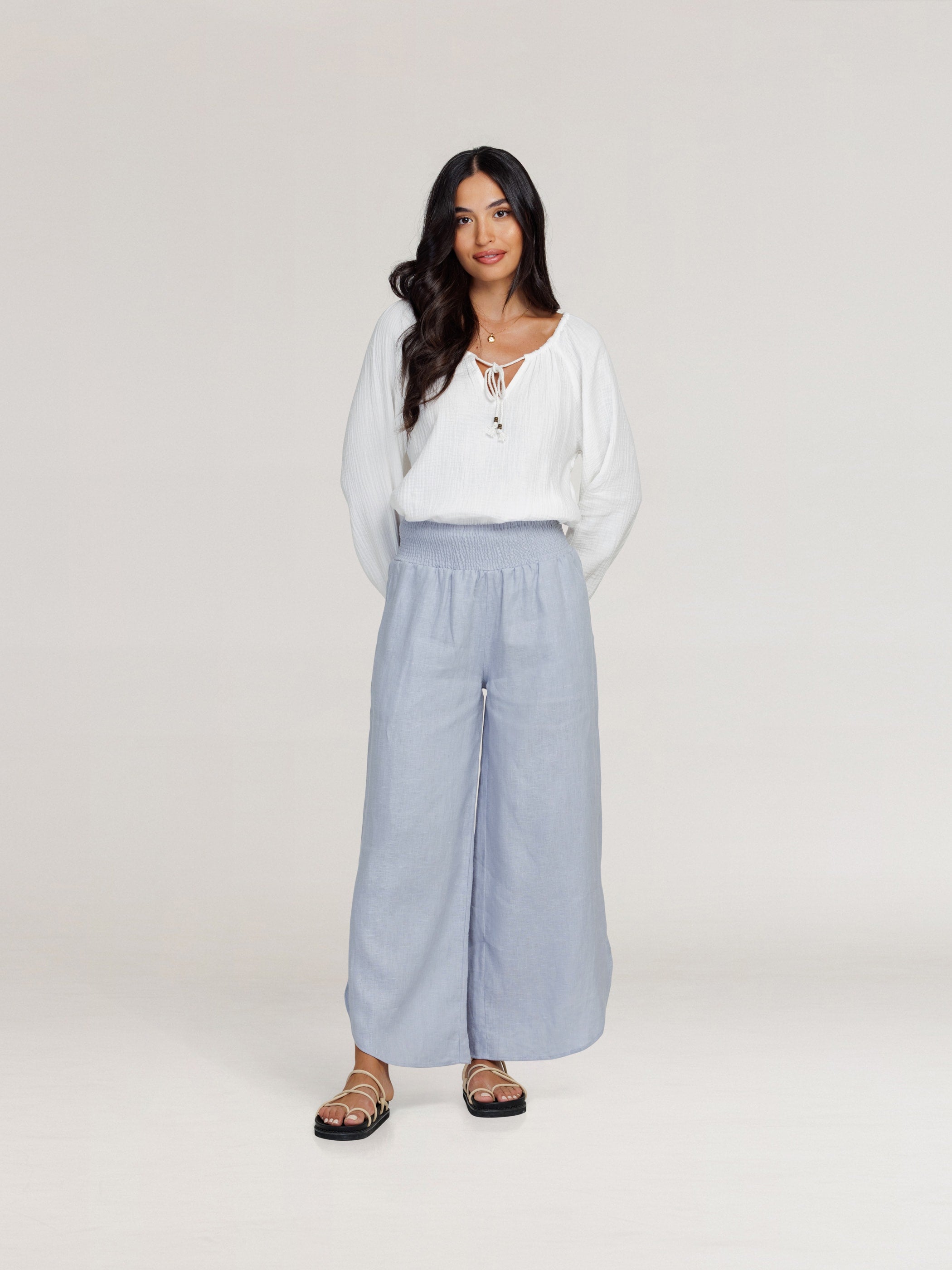 Model wears Sienna Linen Pants in Slate Blue