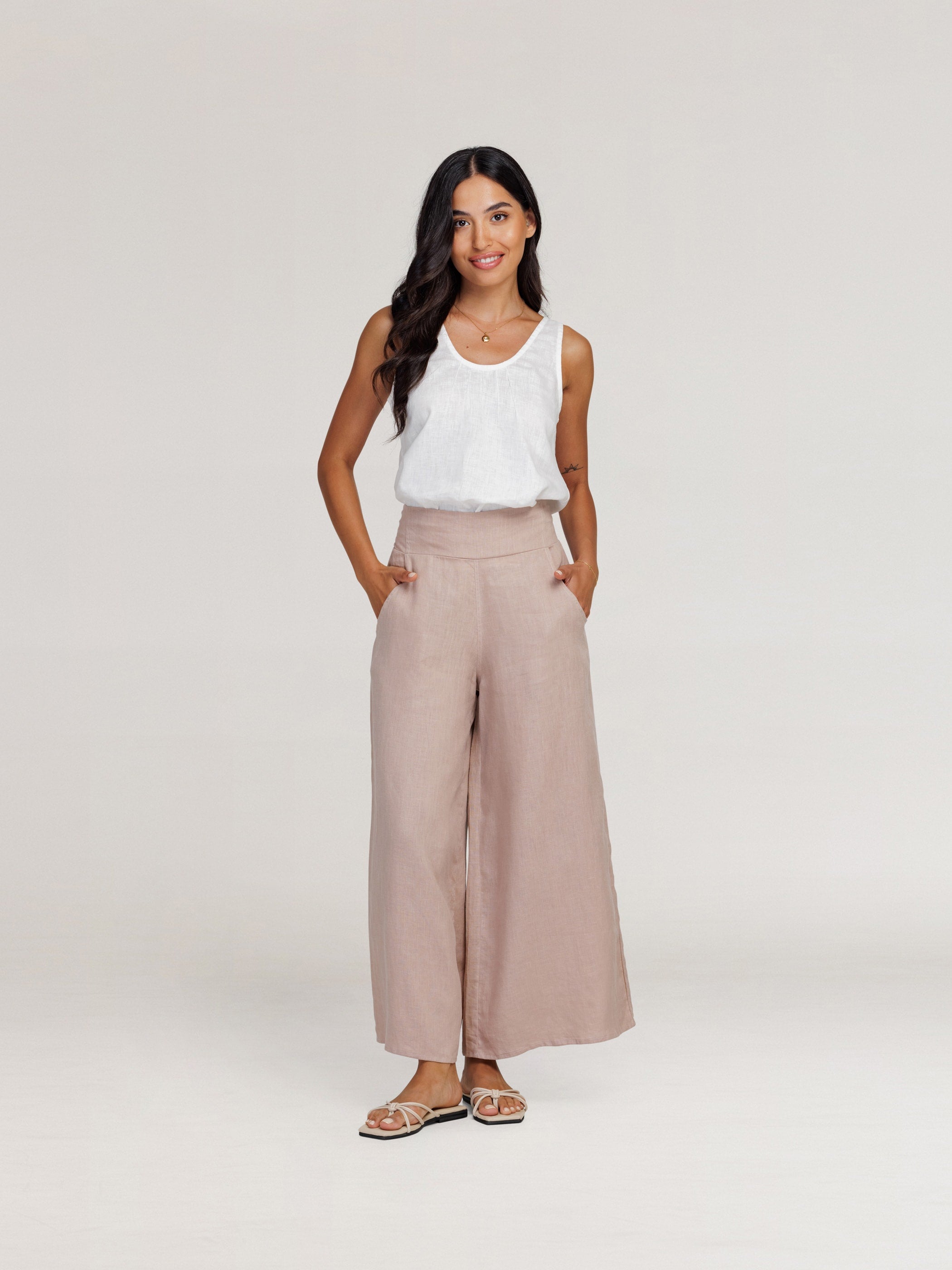 Model wears Portillo Linen Pants in Tea Rose