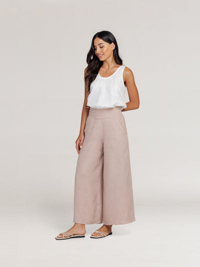 Model wears Portillo Linen Pants in Tea Rose