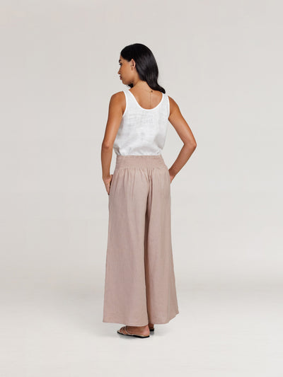 Model wears Portillo Linen Pants in Tea Rose