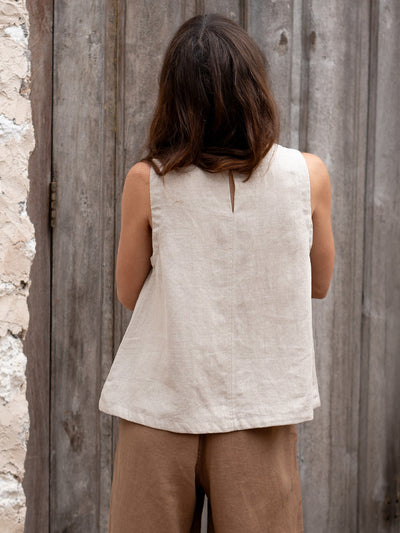 Model is wearing Lucia Linen Top in Flax