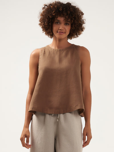 Model is wearing Lucia Linen Top in Desert Sand.