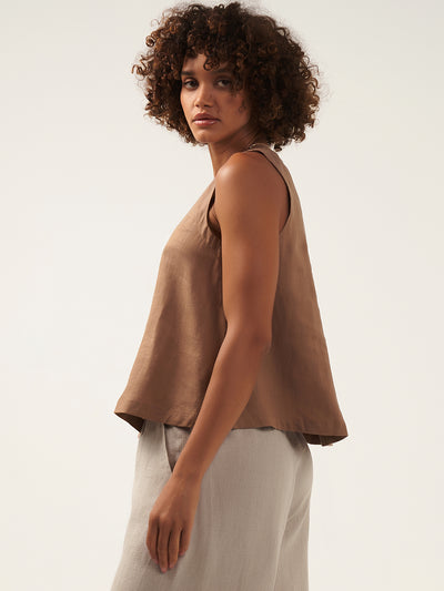 Model is wearing Lucia Linen Top in Desert Sand.