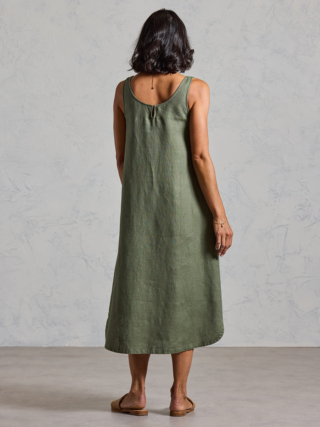 Model wearing Laurel French Linen Dress in Olive colour