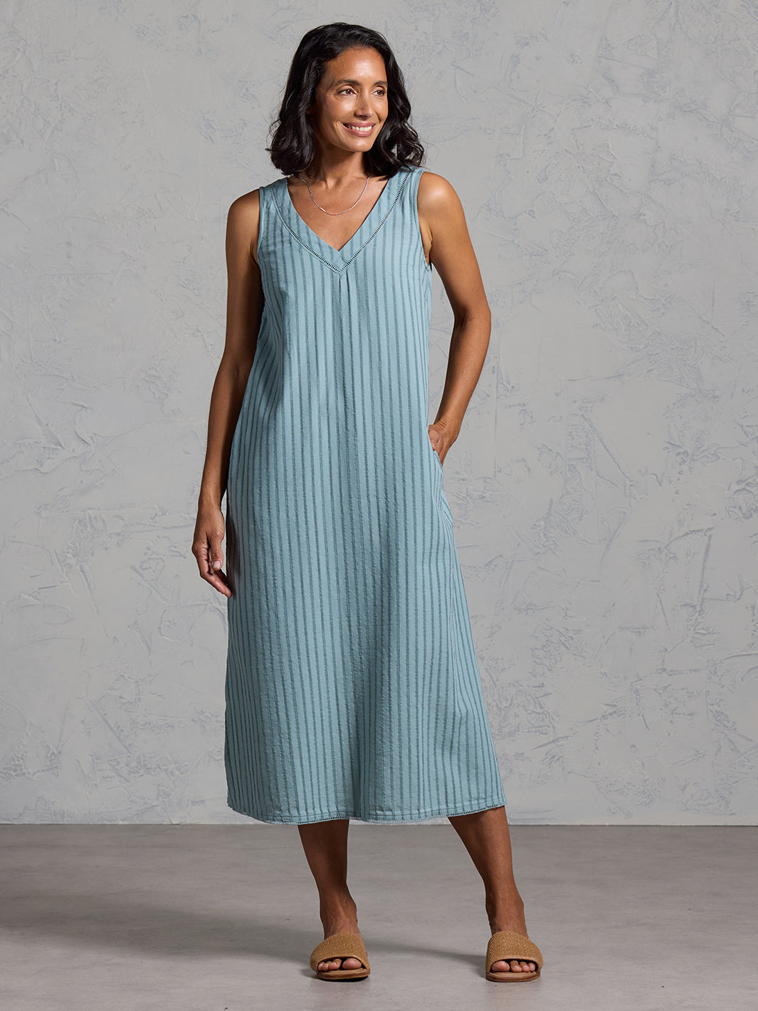 Woman wearing the Mimosa Organic Cotton Dress Marine Green from Nomad the Label