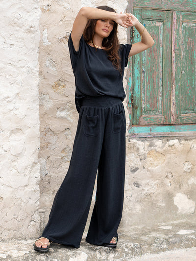 Model is wearing Namaste Linen Blend Pants in Charcoal