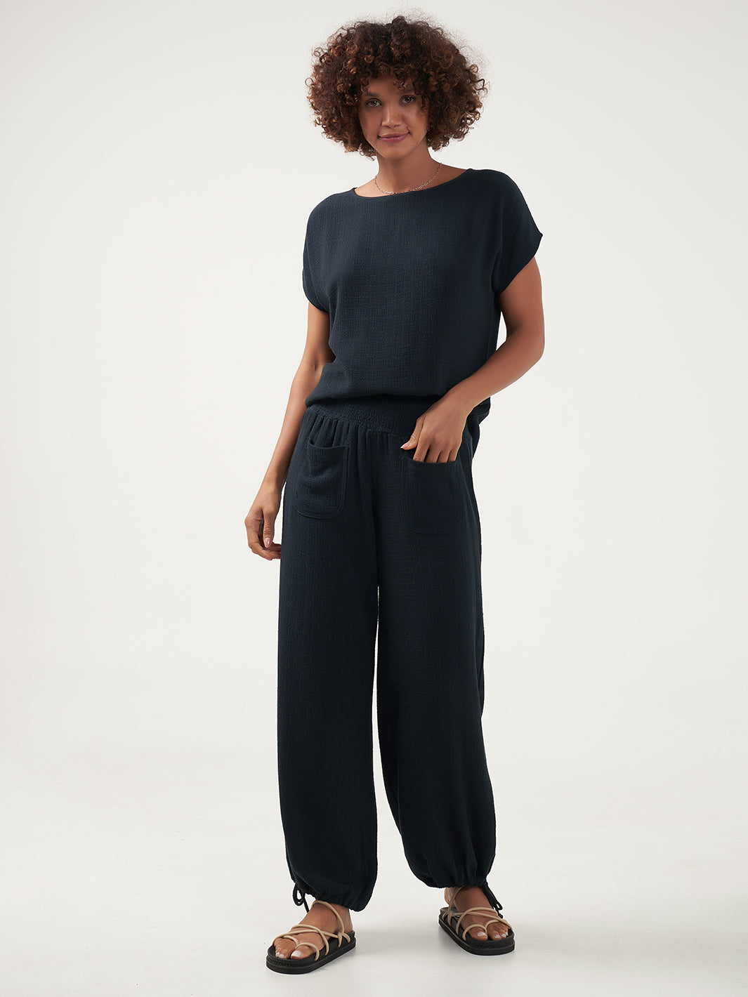 Model is wearing Namaste Linen Blend Pants in Charcoal