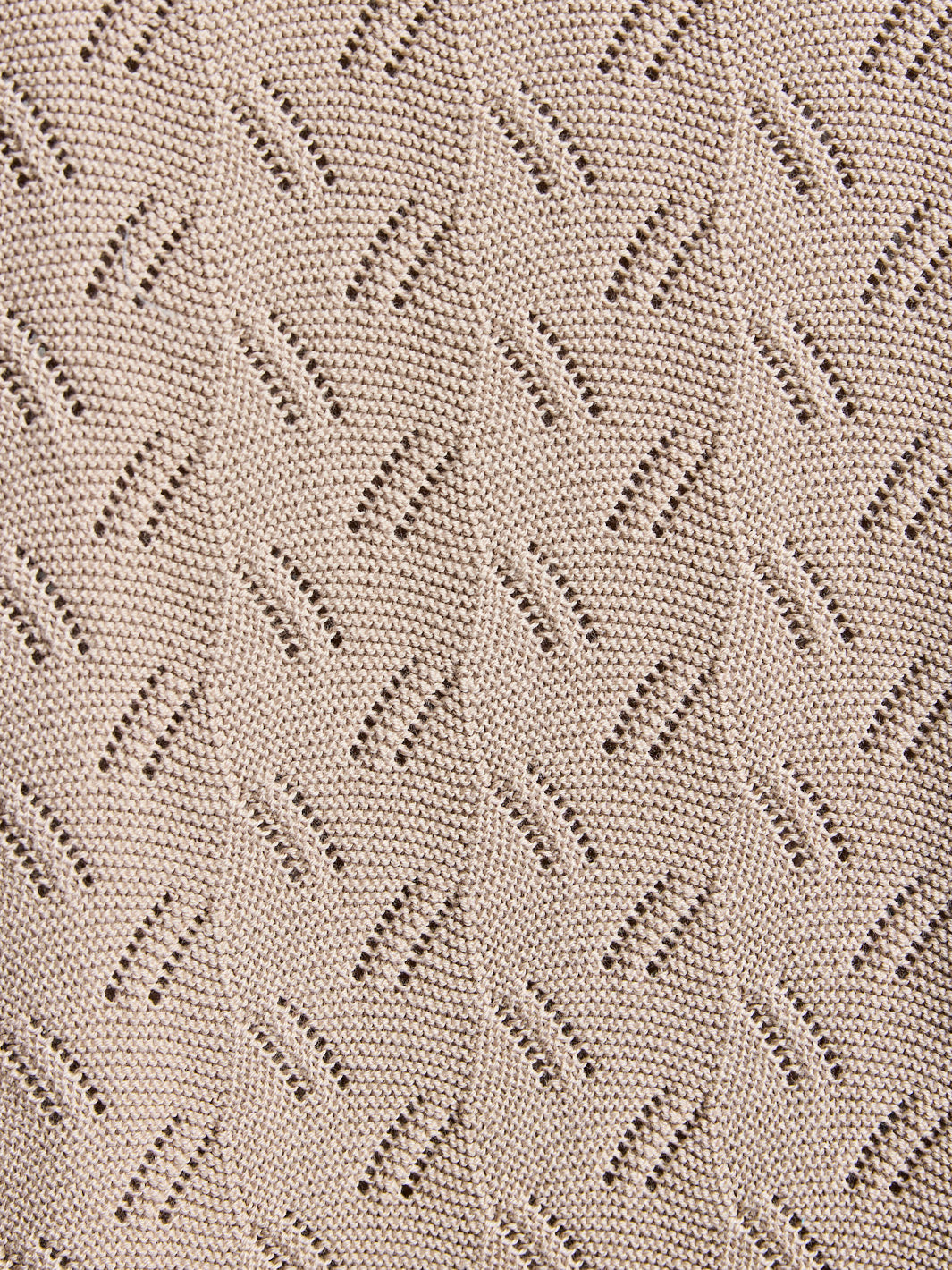 Close-up of a textured fabric with a geometric pattern