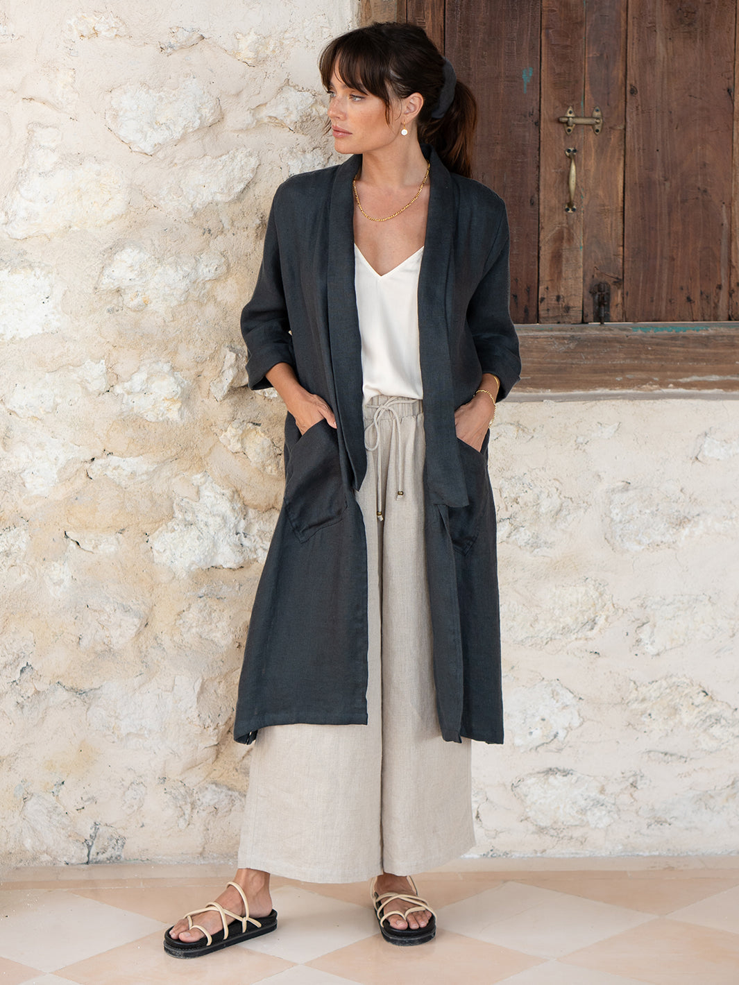 Model is wearing Nova Longline Linen Coat in Charcoal