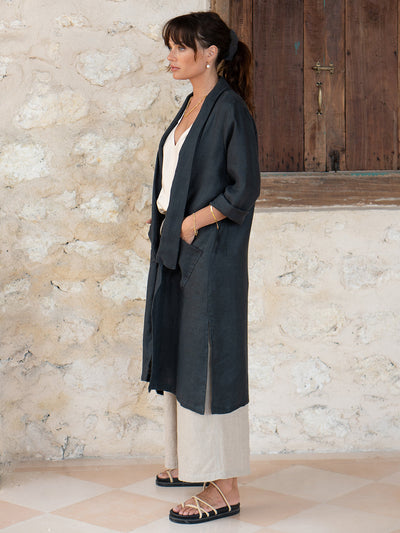 Model is wearing Nova Longline Linen Coat in Charcoal