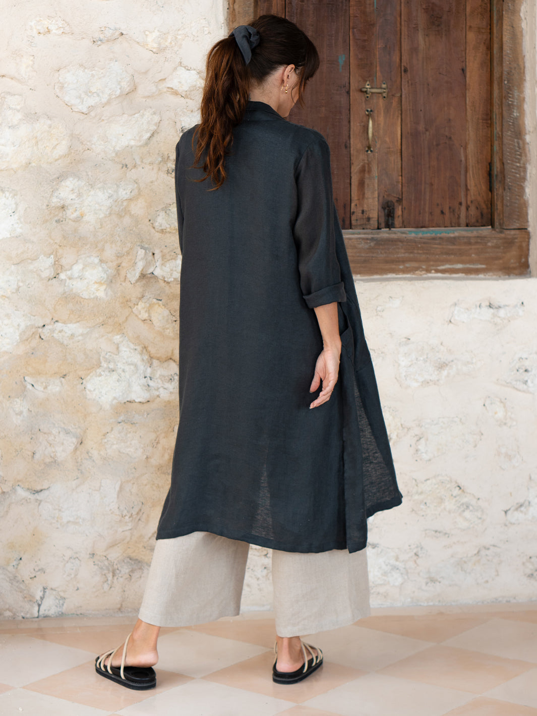 Model is wearing Nova Longline Linen Coat in Charcoal