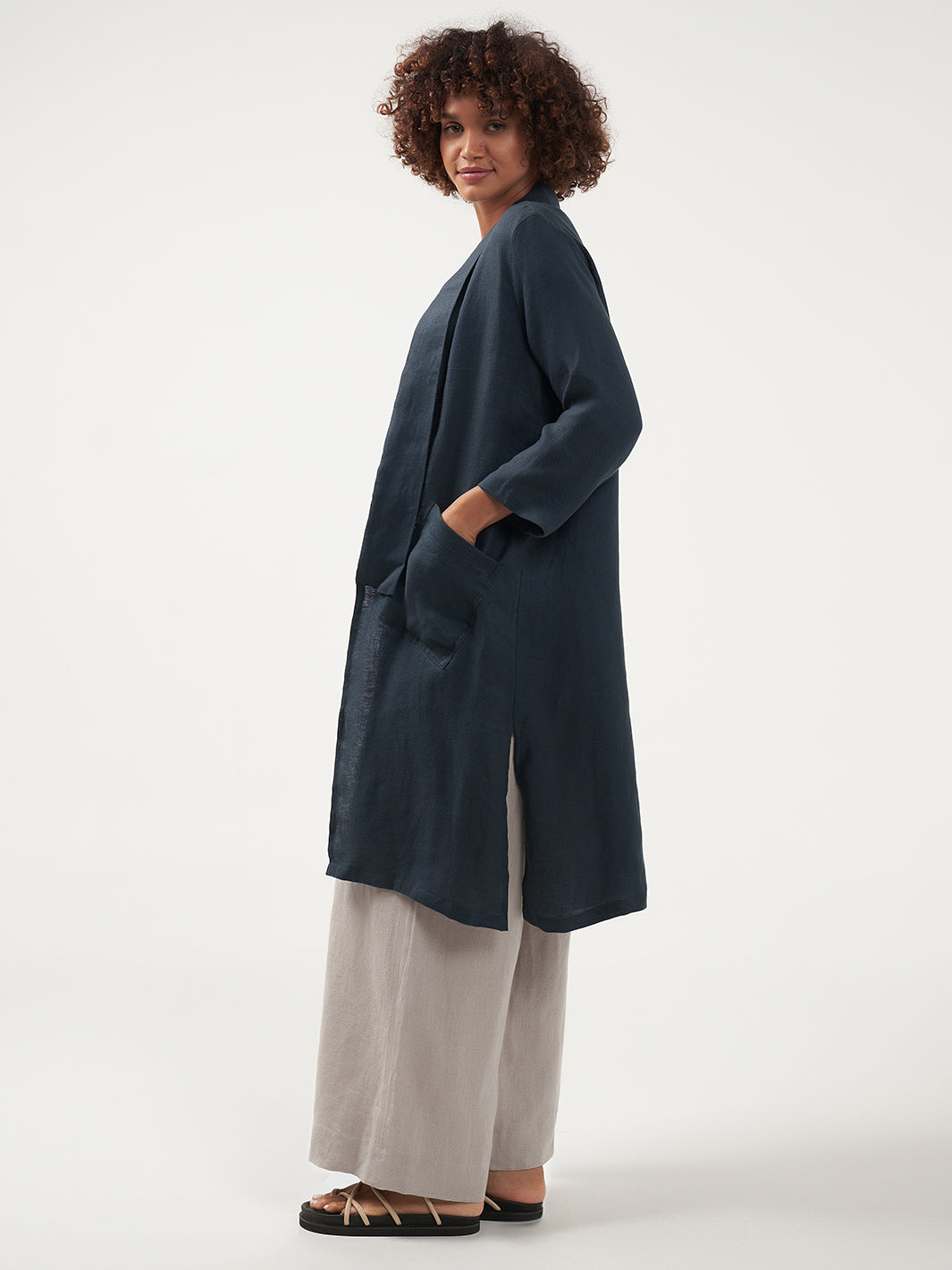 Model is wearing Nova Longline Linen Coat in Charcoal