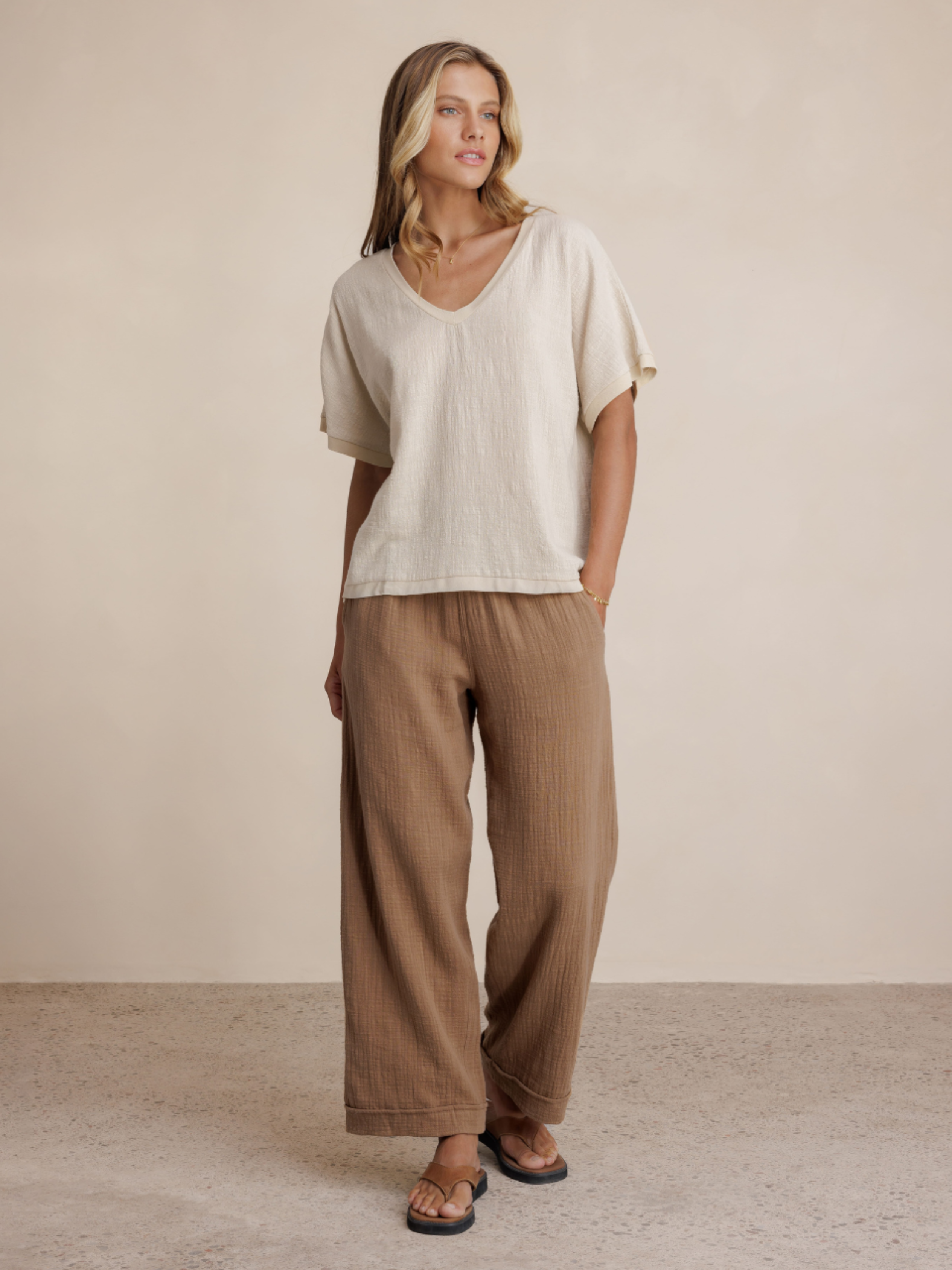 Model wears Sancia Cotton Pants in Desert Sand