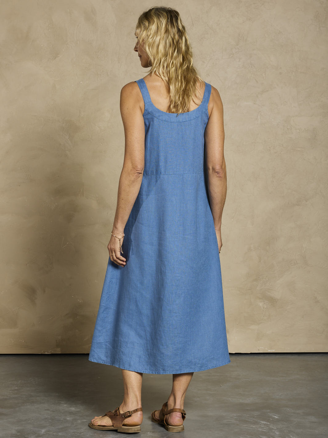 Woman wearing a blue linen dress 