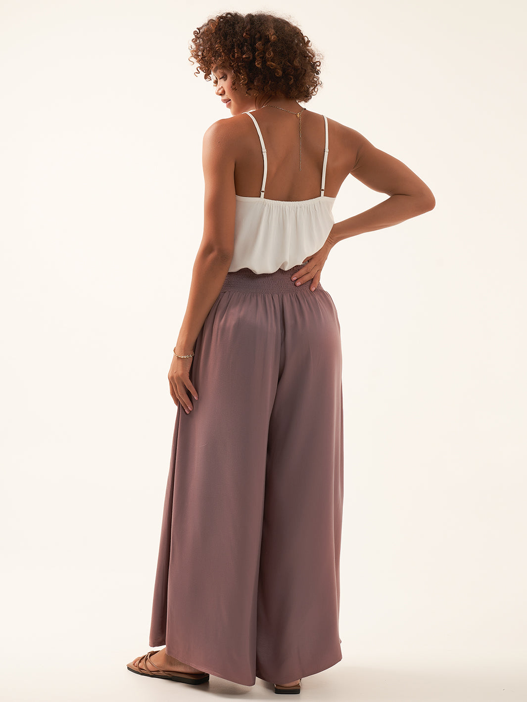 Model wears Palazzo Ecovero™ Pants in Plum