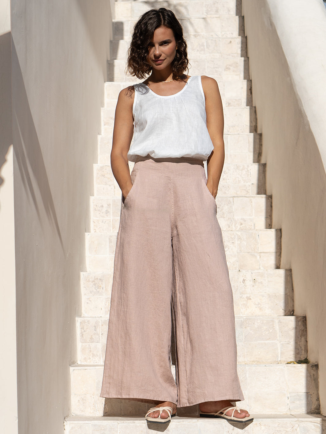 Model wears Portillo Linen Pants in Tea Rose