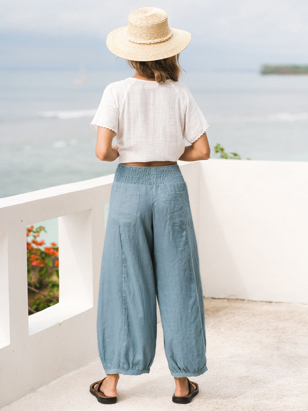 Model wears Sadhu French Linen Pants Regular in Tahiti Blue