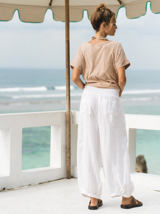Model wears Sadhu French Linen Pants  Regular in White