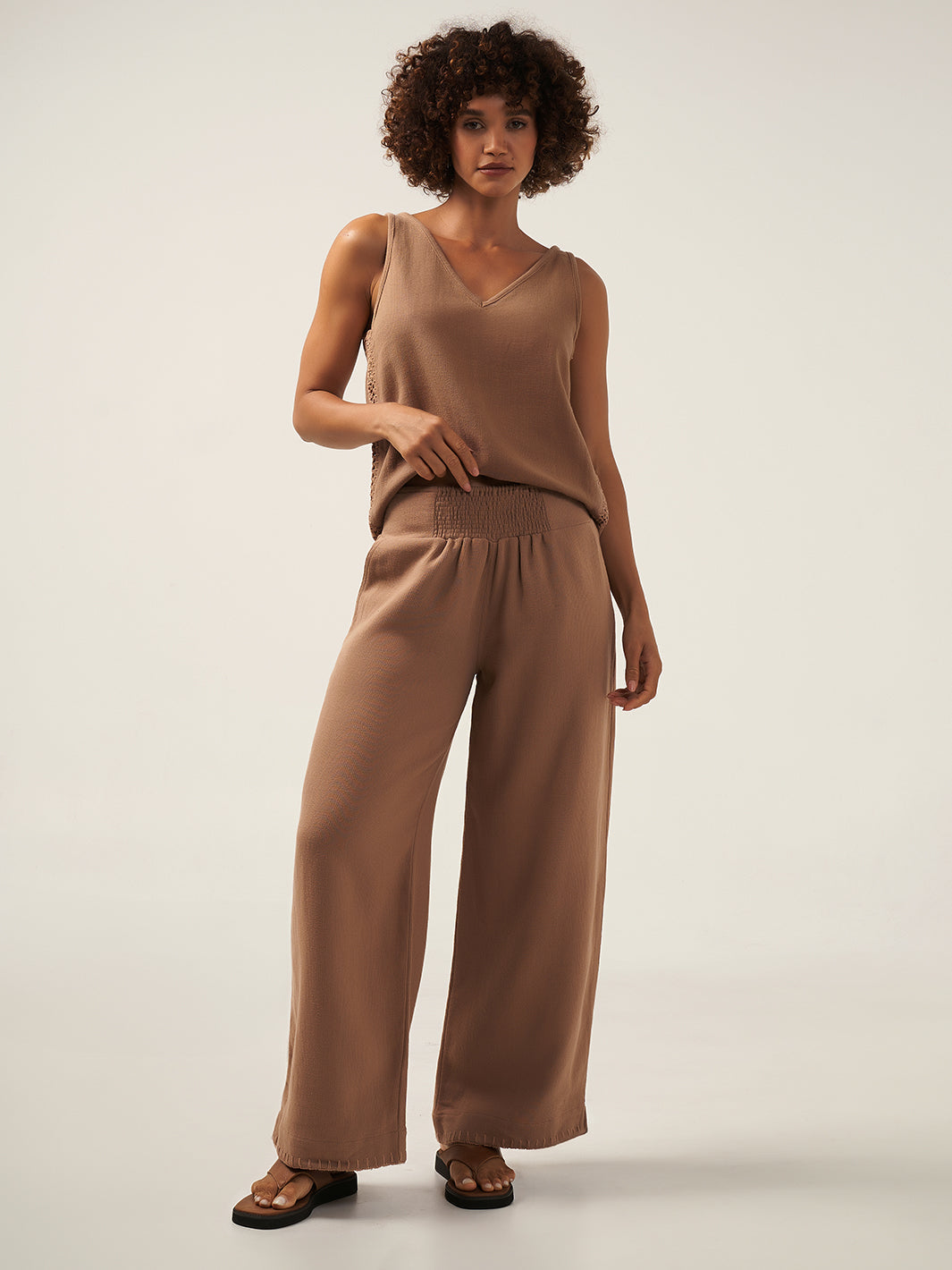 Model is wearing Sula Ramie Pants in Desert Sand