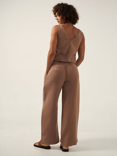 Model is wearing Sula Ramie Pants in Desert Sand