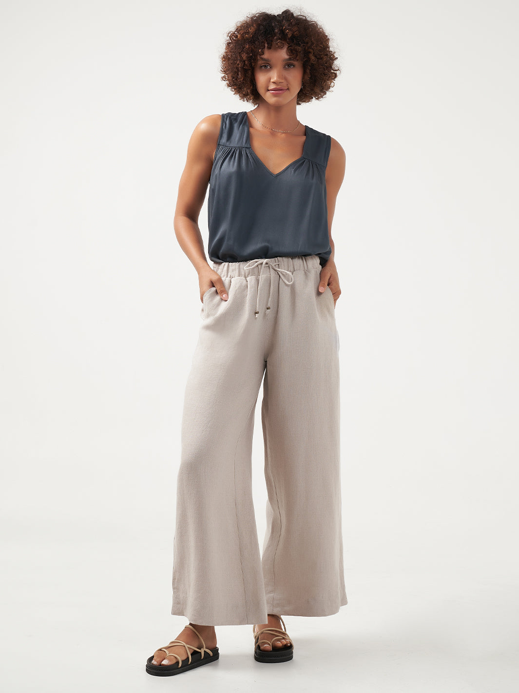 Model is wearing Sundara Linen Pants in Flax.