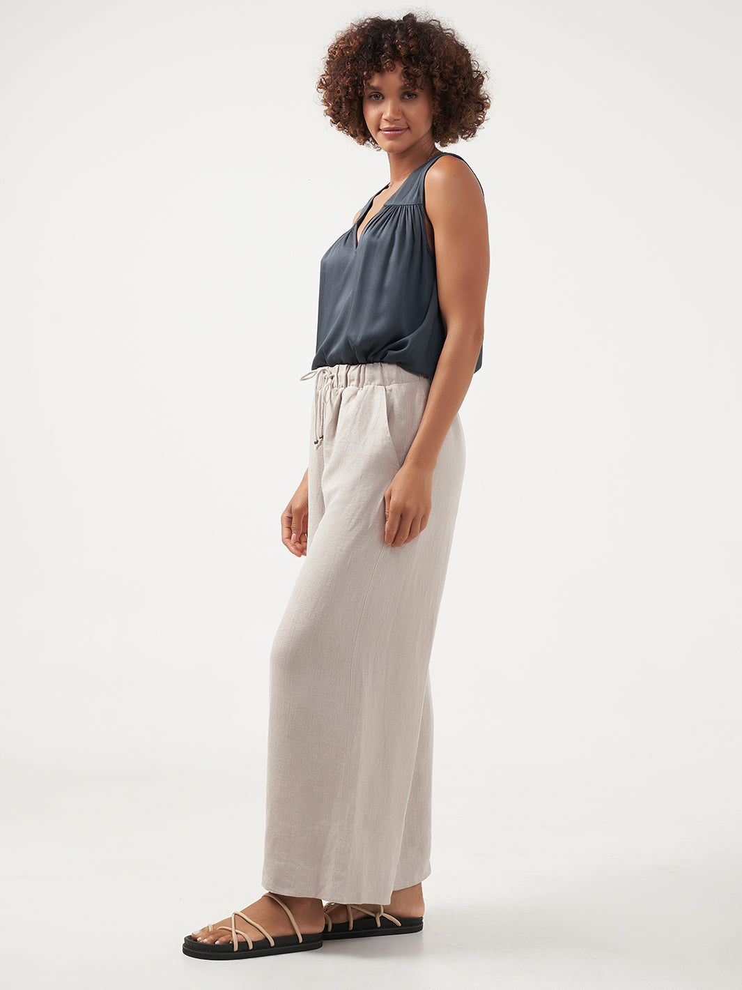 Model is wearing Sundara Linen Pants in Flax.