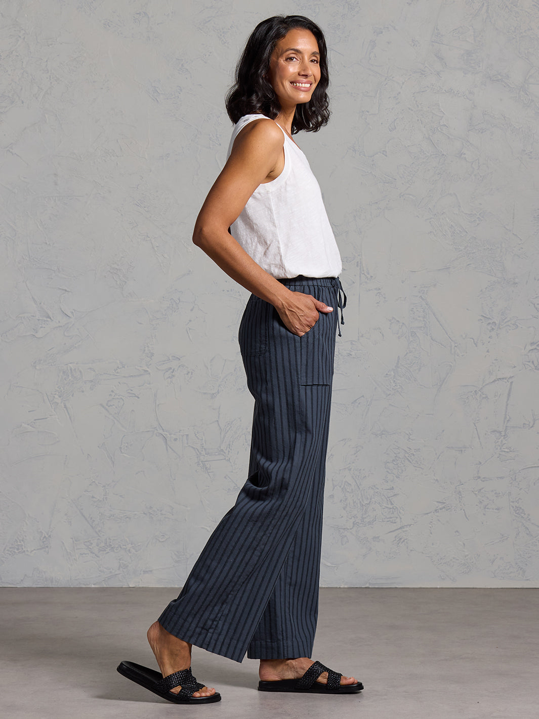 Woman wearing Sidari Organic Cotton Pants Charcoal from Nomad the Label