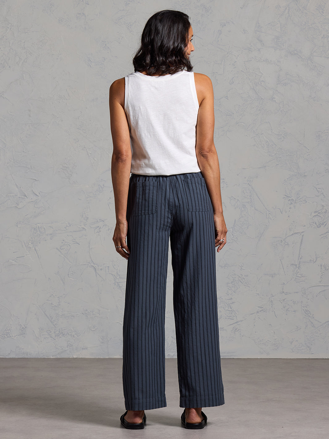 Woman wearing Sidari Organic Cotton Pants Charcoal from Nomad the Label