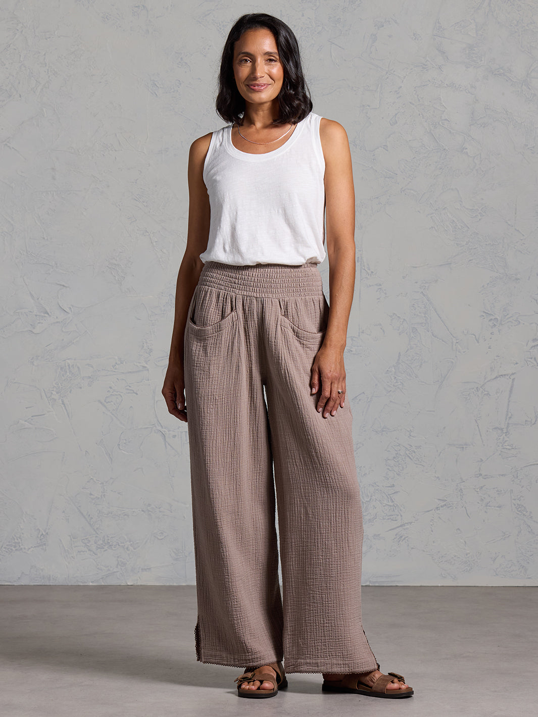 A woman wearing Sur Mer Organic Cotton Pants Elm and Yarra Cotton Top Coconut from Nomad the Label