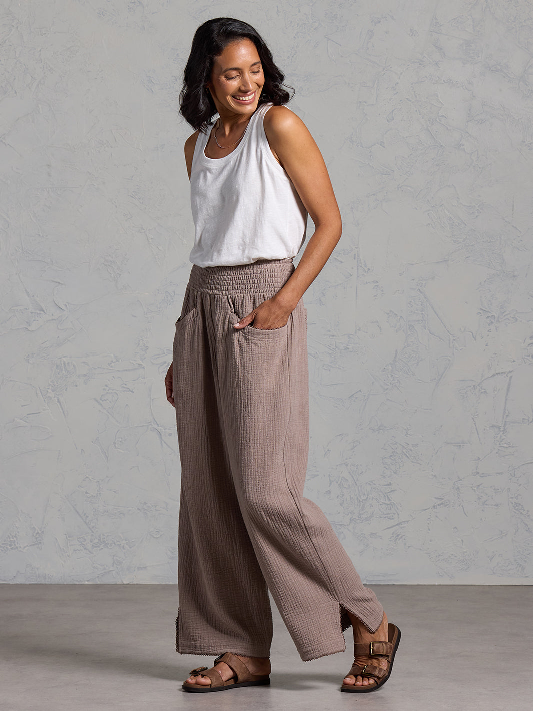 A woman wearing Sur Mer Organic Cotton Pants Elm and Yarra Cotton Top Coconut from Nomad the Label
