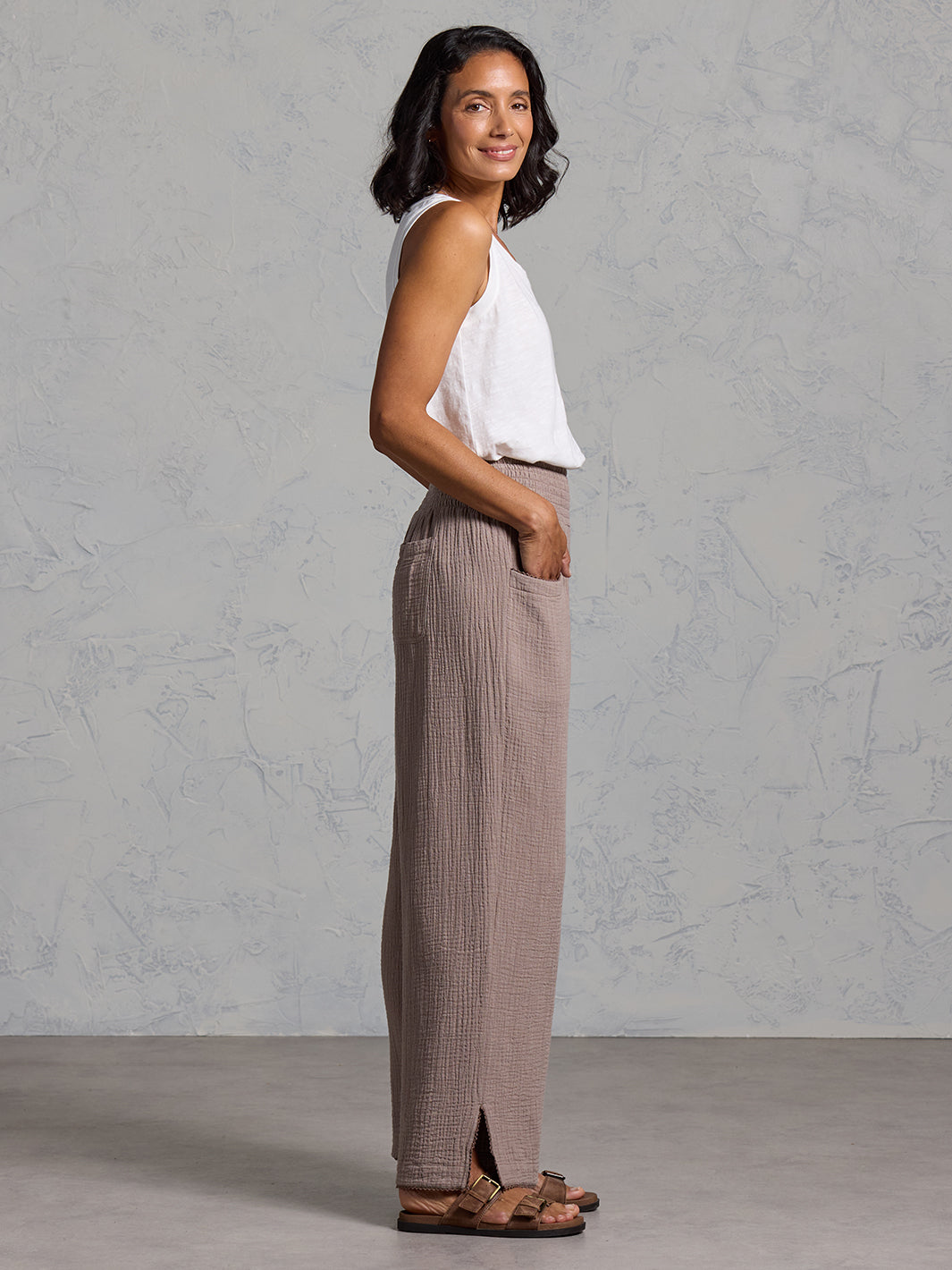 A woman wearing Sur Mer Organic Cotton Pants Elm and Yarra Cotton Top Coconut from Nomad the Label