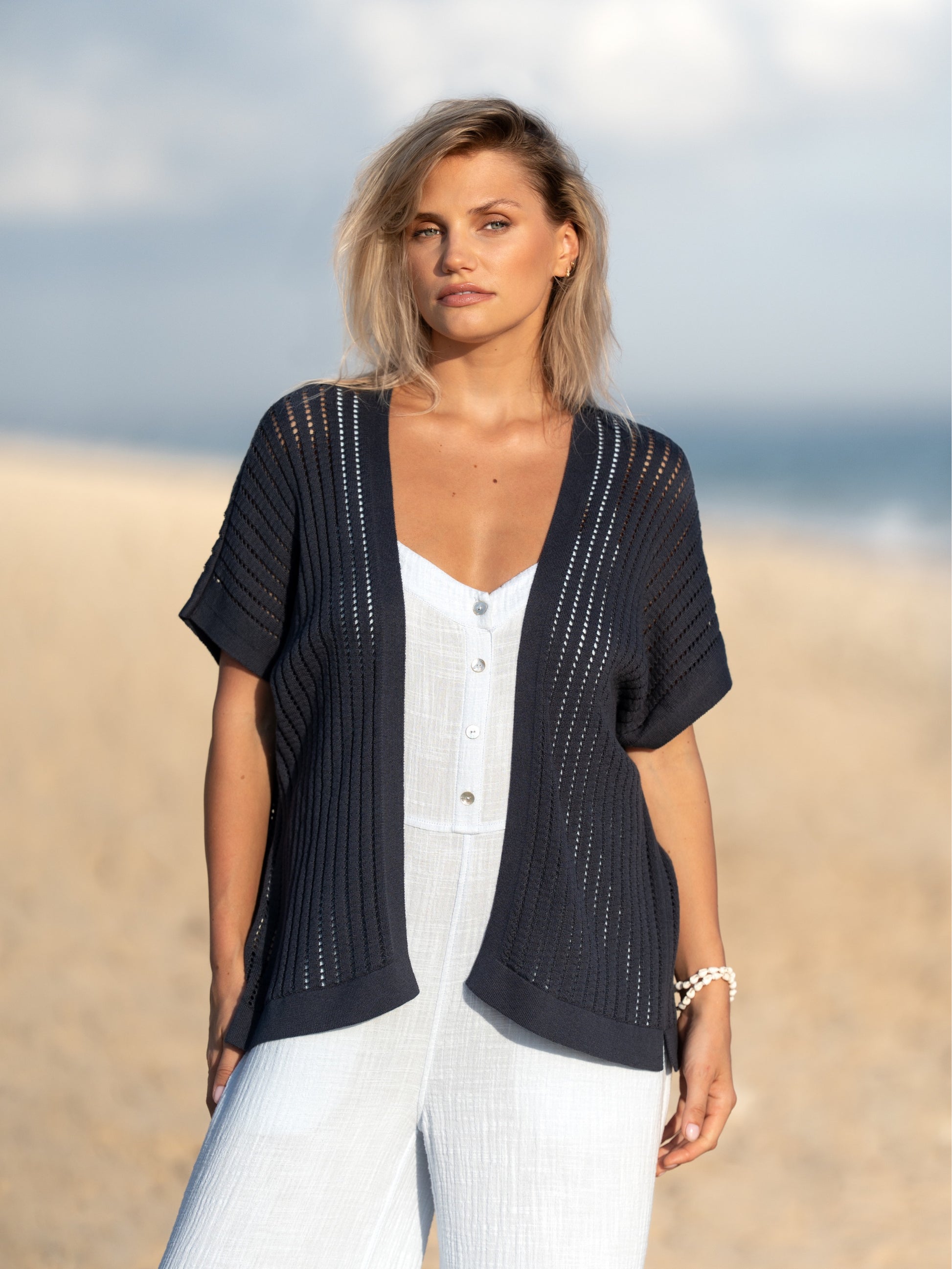 A woman wearing a charcoal cotton kimono from Nomad the Label