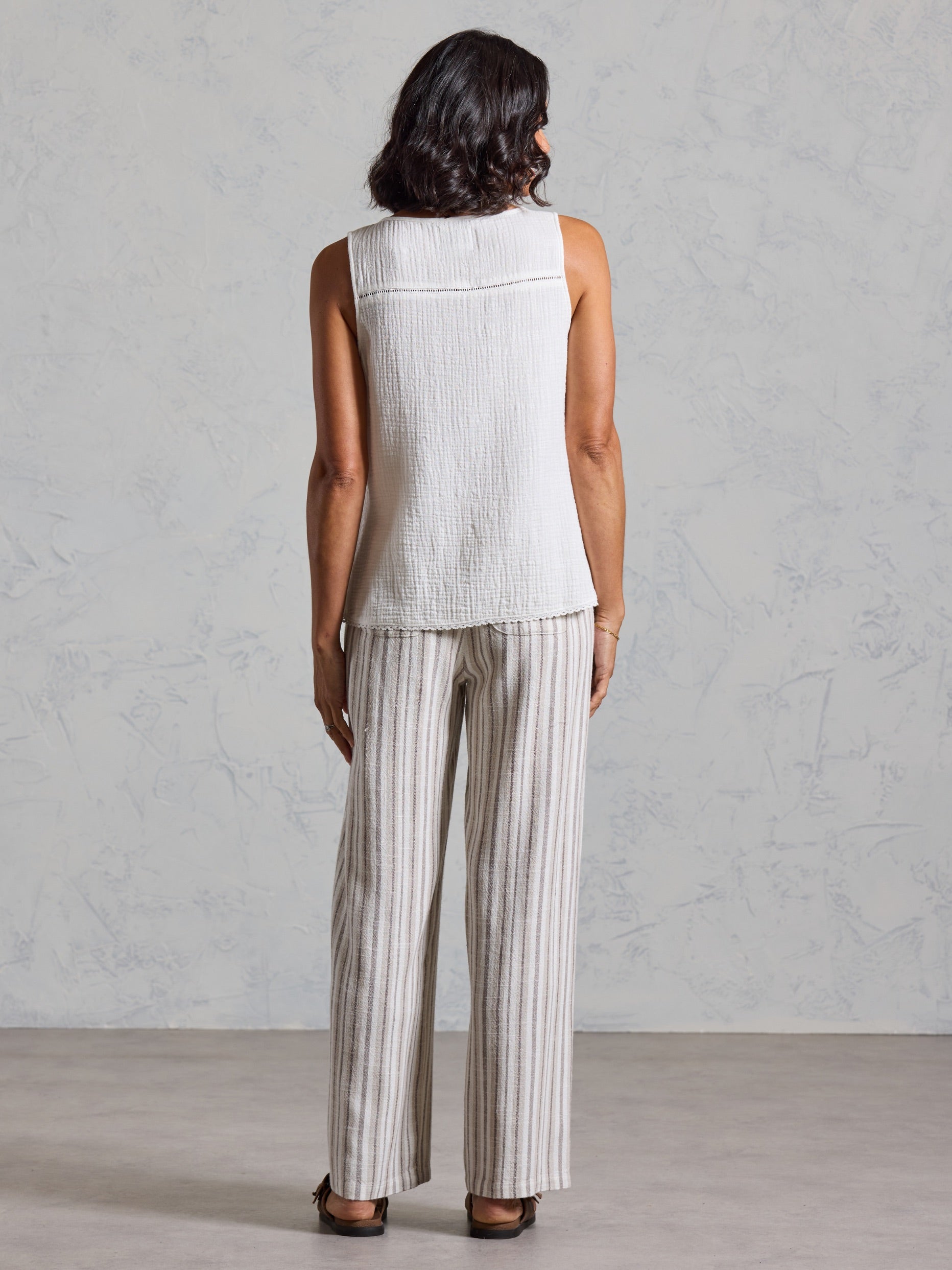 Back view of the Ceres Organic Cotton Top in coconut showing the textured cotton and yoke seam detail.
