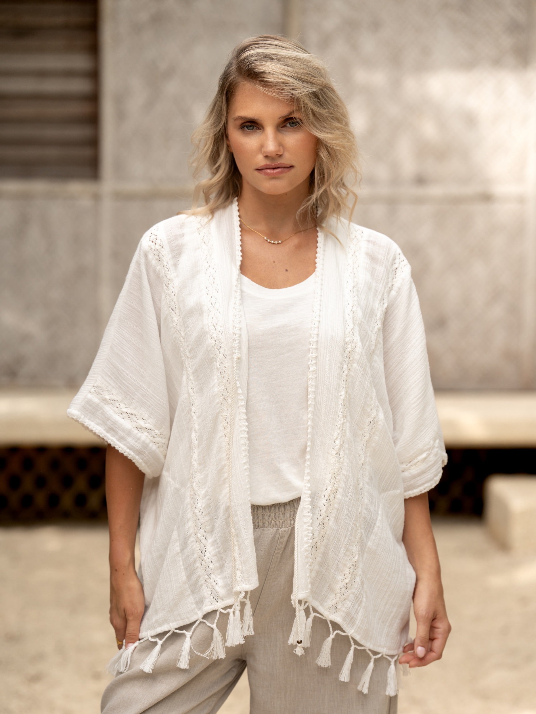 Woman wearing the Solaris Cotton Kimono Coconut from Nomad the Label
